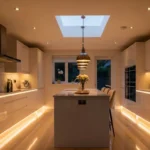 "Elegant modern kitchen with warm lighting, marble countertops, glossy white cabinets, pendant lights over a central island, and soft natural light streaming through a large window."
